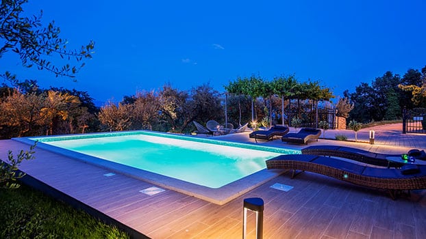 holiday home with swimming pool at night